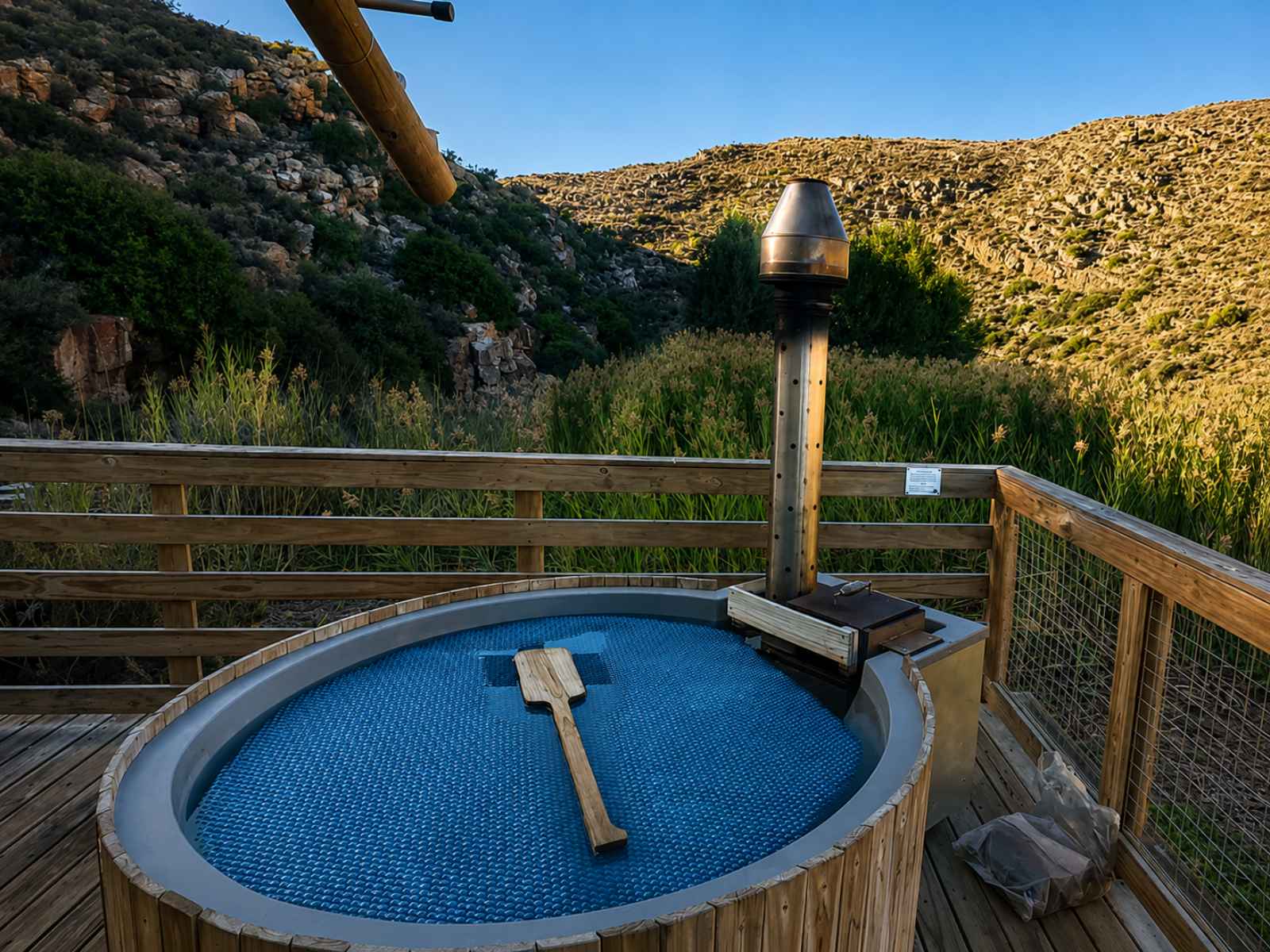 AfriCamps at Karoo 1 - the wood-fired hot tub at sunset